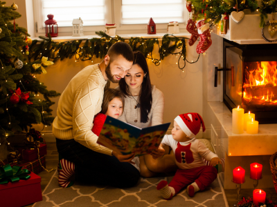 Family reading a Christmas book.