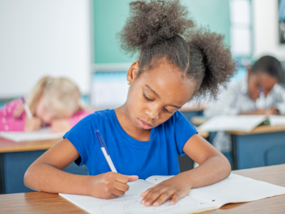 Girl writing and drawing