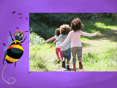 Child running in grass with Night Zookeeper Bertie the Bee..