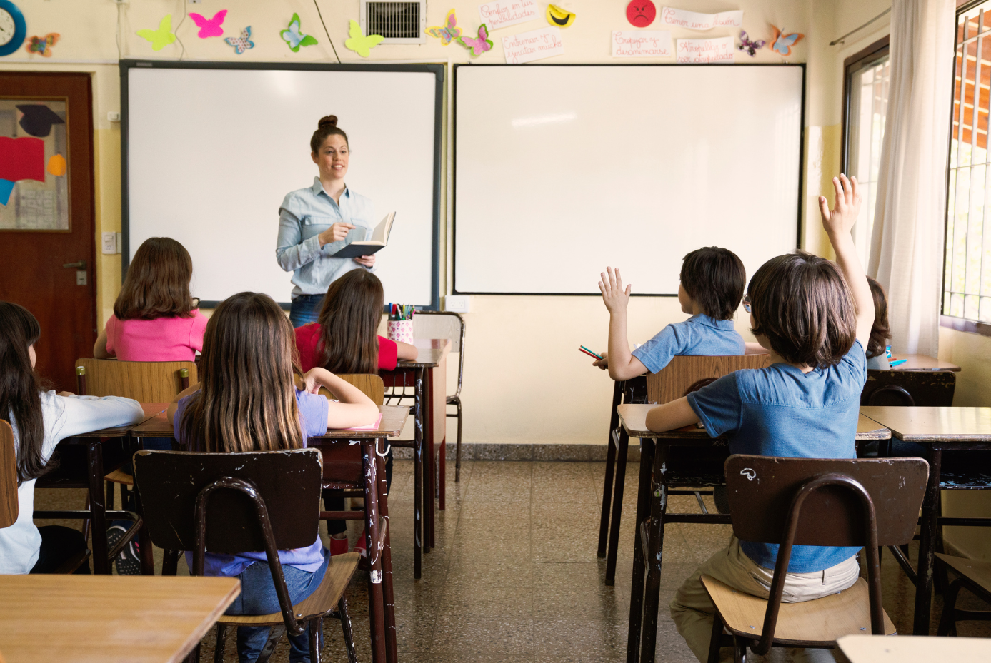 Children debating in classroom.