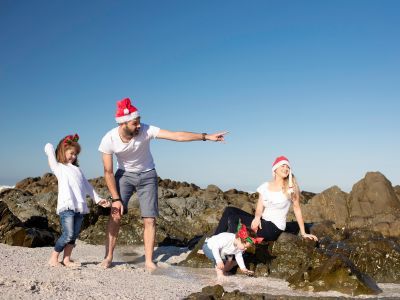 Family celebrating Christmas at the beach.