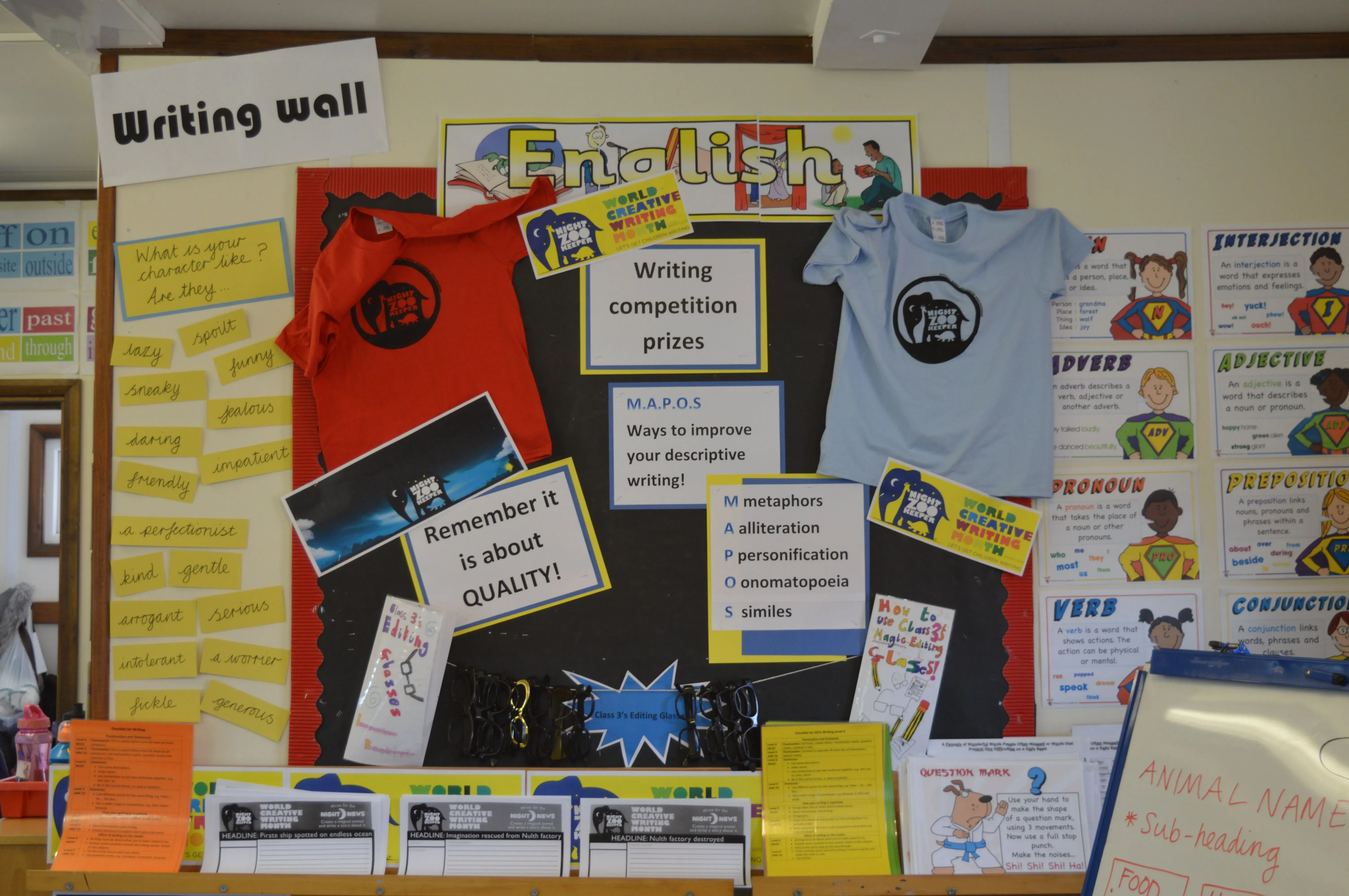 School display board for English reading and writing and Night Zookeeper tshirts.