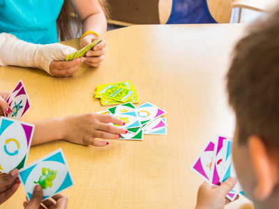 Children playing with cards