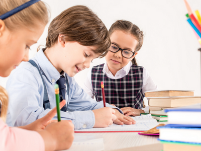 Children writing together