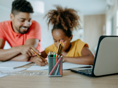 Image of parent homeschooling their child.