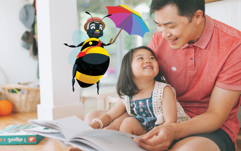 Child and parent reading with Bertie Bee. 