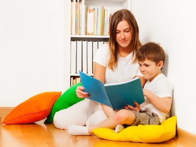 Parent and child reading together.