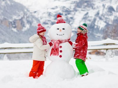 Children building a snowman.