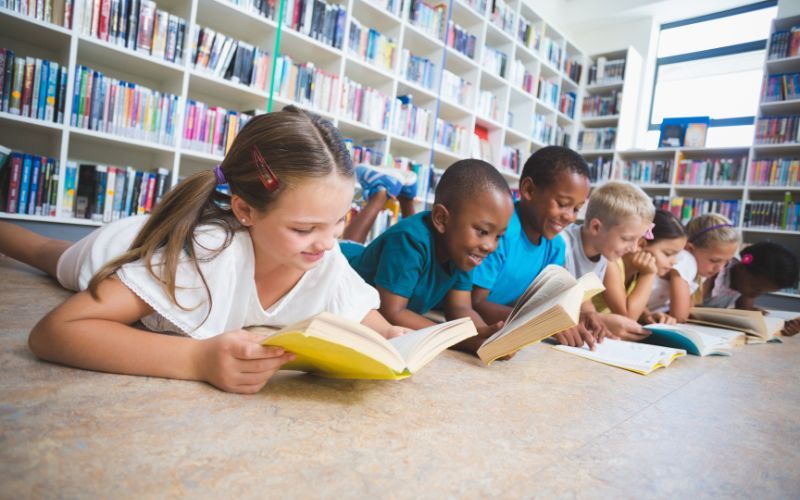 Night Zookeeper characters reading in library