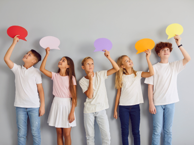 Children holding speech bubbles.