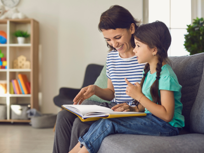 Parent and child reading together.