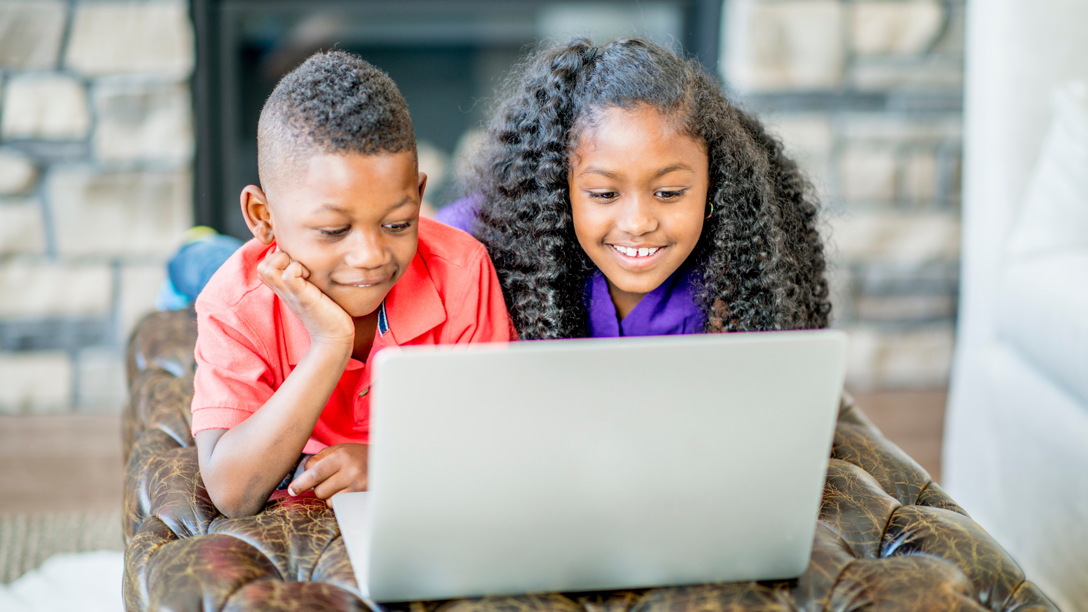 Two children, using positive screen time to learn.