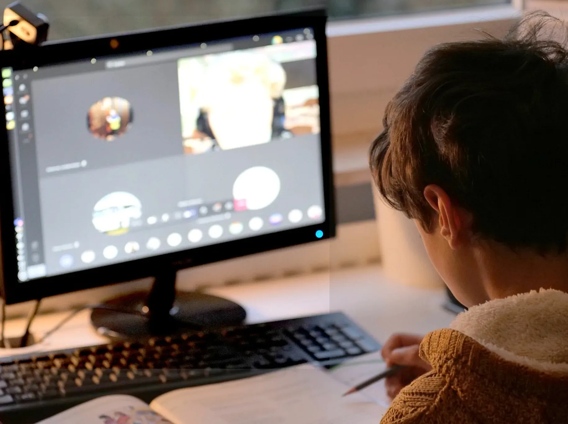 Child studying over zoom