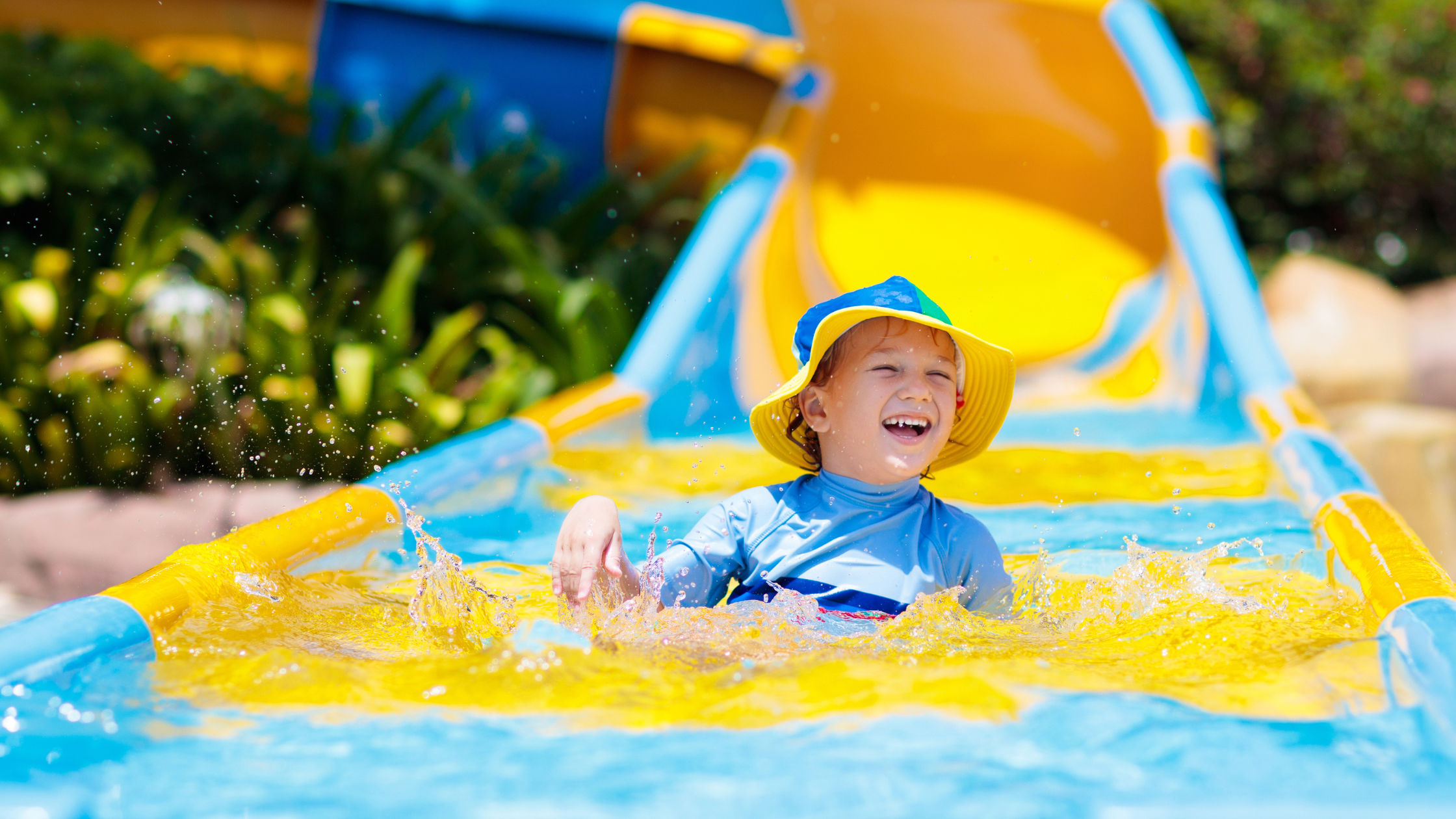 Children on a water slide.