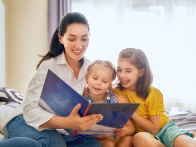 Parent reading to their children.