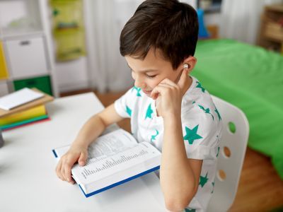 Child using a thesaurus.