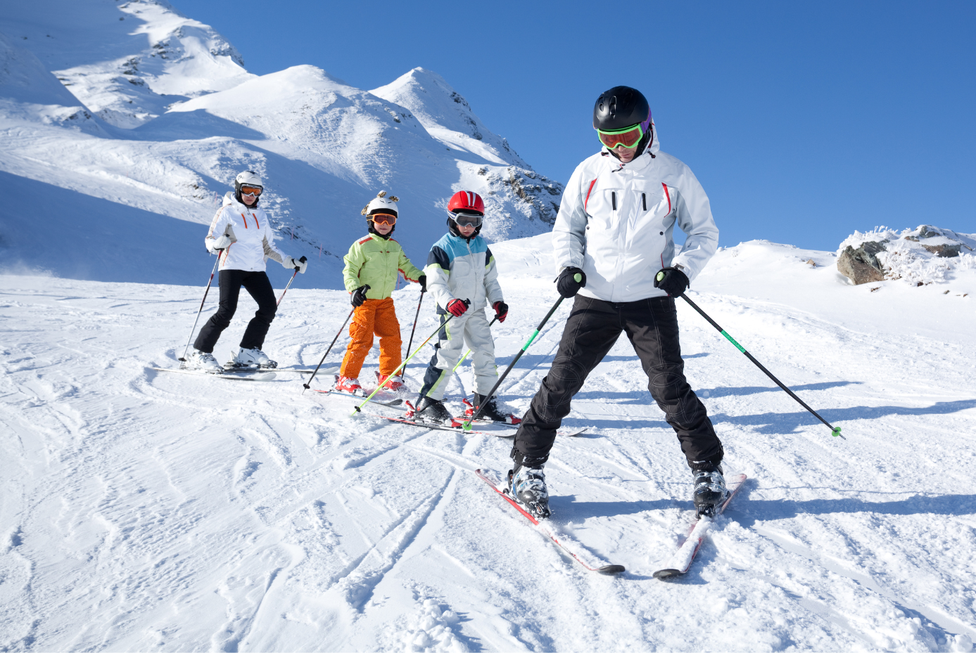 Family skiing in the mountains.