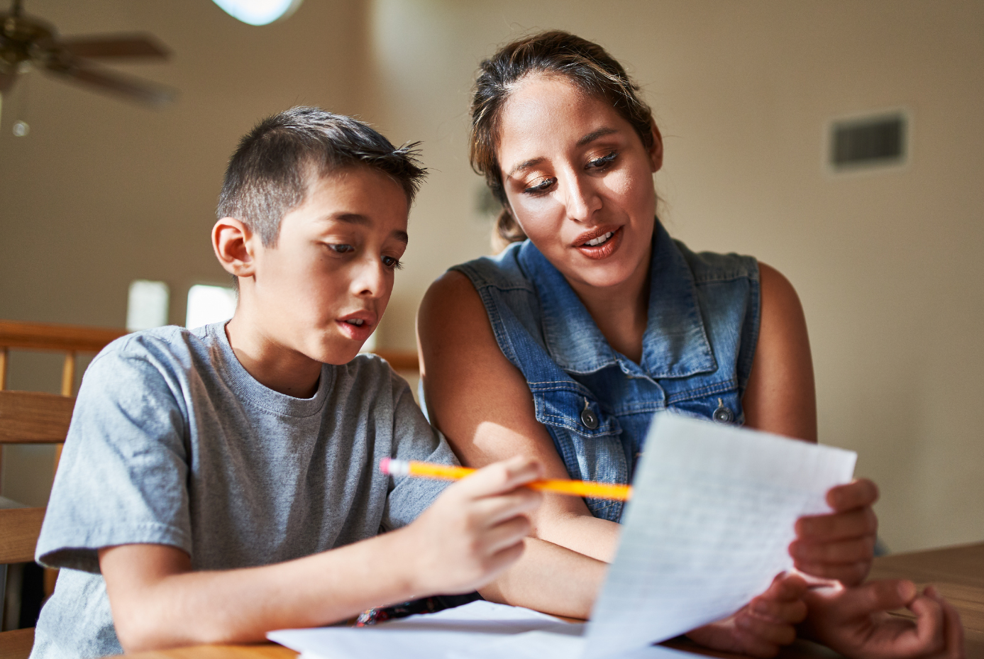 Mother and child, writing together.