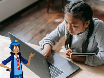 Child typing on laptop, with Will Night Zookeeper. 