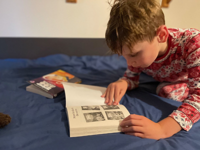 Child reading Night Zookeeper