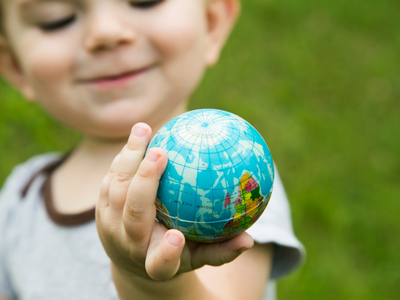Child holding small globe
