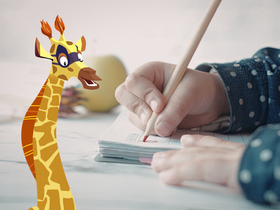 Child's hand writing on paper, with Sam the Giraffe.