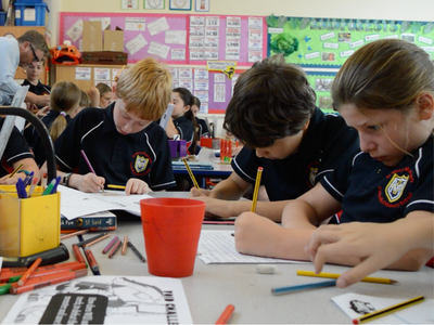 Children drawing in classroom