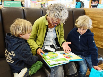 Grandmother reading to children