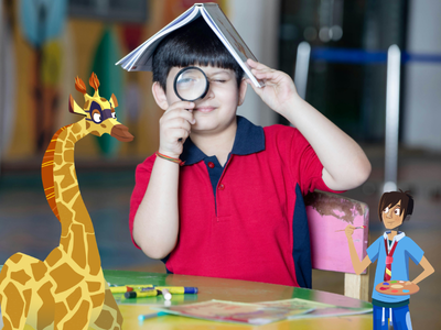 Child sitting at desk with a book on their head and a magnifying glass, with Will and Sam. 