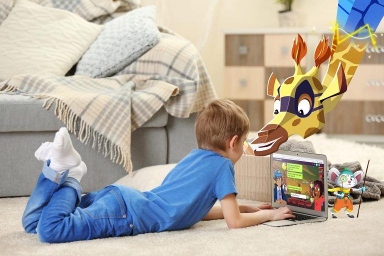 Boy with laptop on the floor.