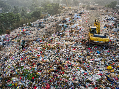 Trash dump with trucks