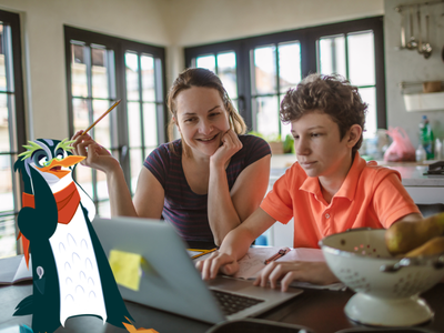 Mom and child typing on a laptop.